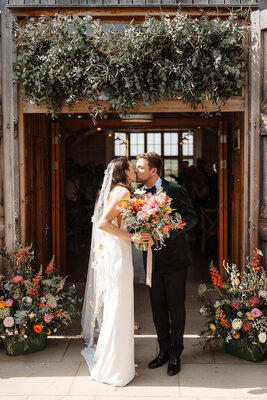 Beautiful wedding ceremony floral display at Hyde House - romantic flower arch and decorations